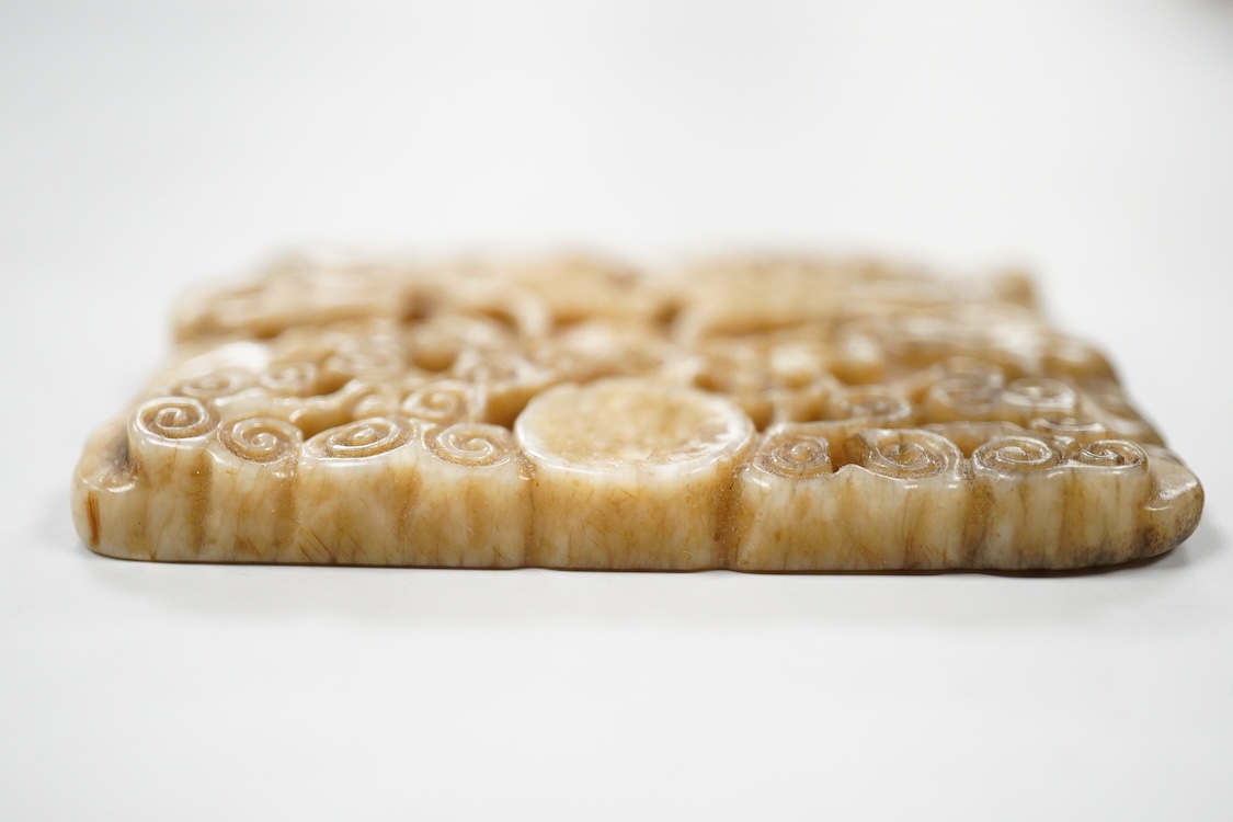 A Chinese russet jade rectangular plaque, 7cm wide